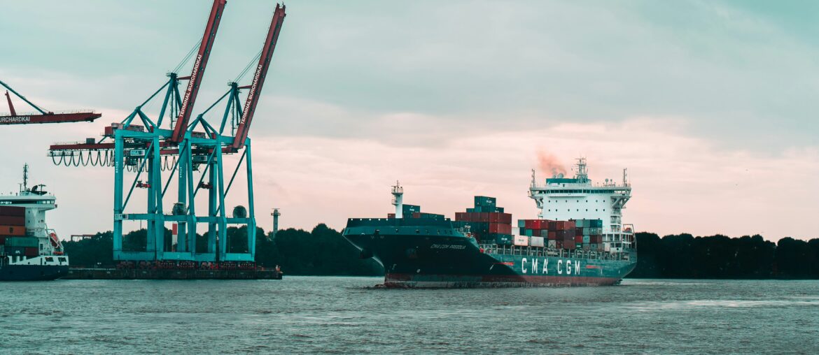 Container ship at anchor in commercial port
