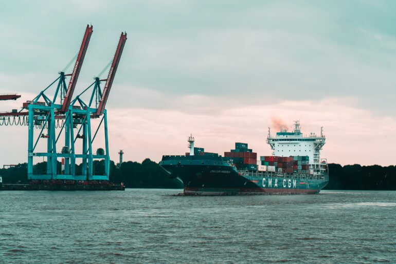 Container ship at anchor in commercial port
