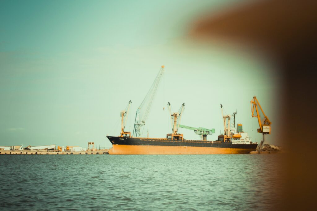 Cargo vessel at anchor near port waiting for berth
