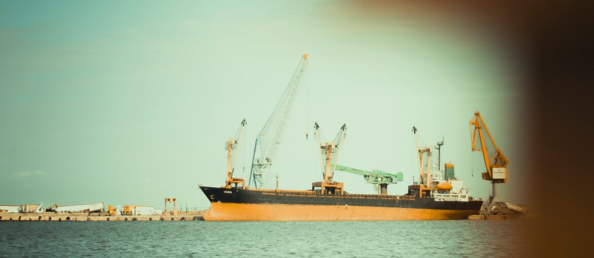Cargo vessel at anchor near port waiting for berth