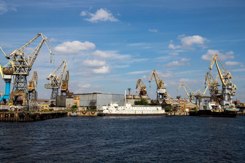 Commercial port with cargo cranes and vessels