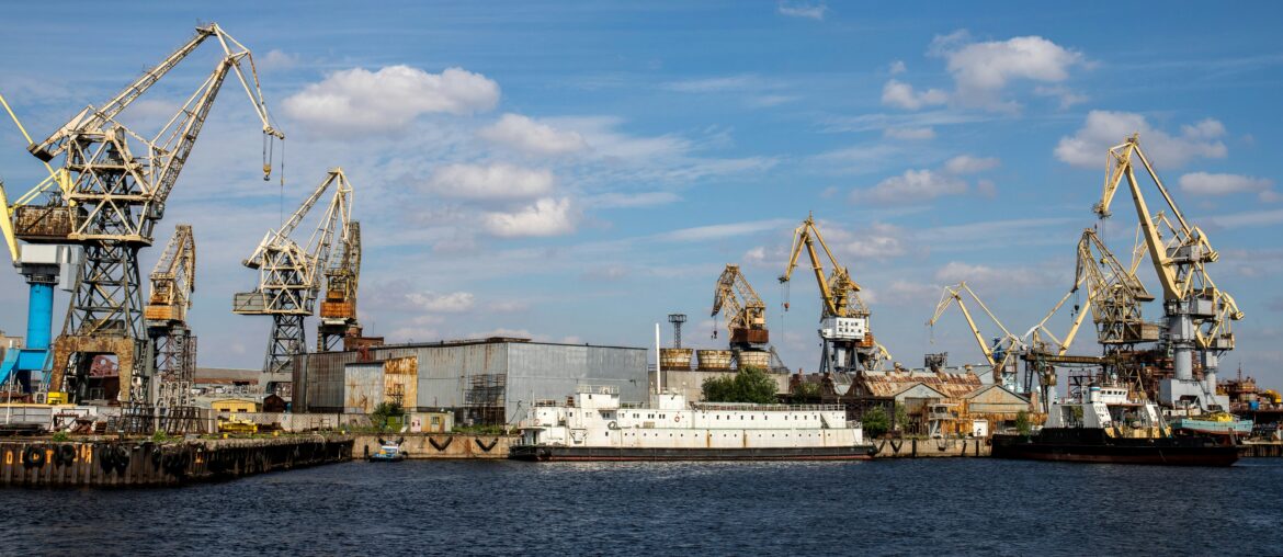 Commercial port with cargo cranes and vessels