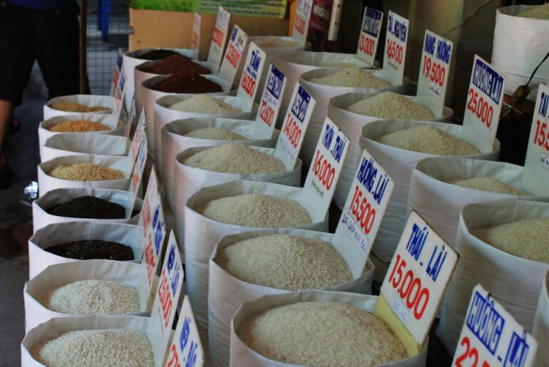 Sacks of rice at a market, illustrating the international rice trade