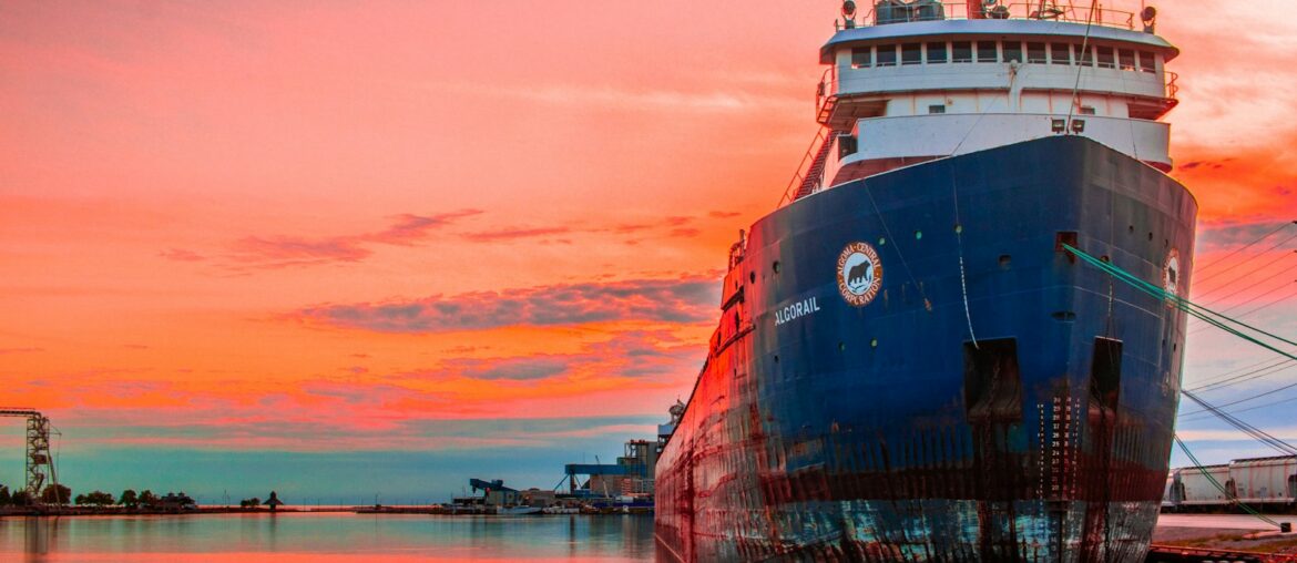 Oil tanker moored at the port at sunset - ship sale under Saleform 2012