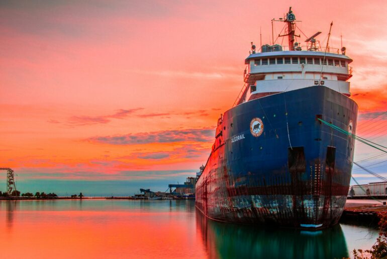 Oil tanker moored at the port at sunset - ship sale under Saleform 2012